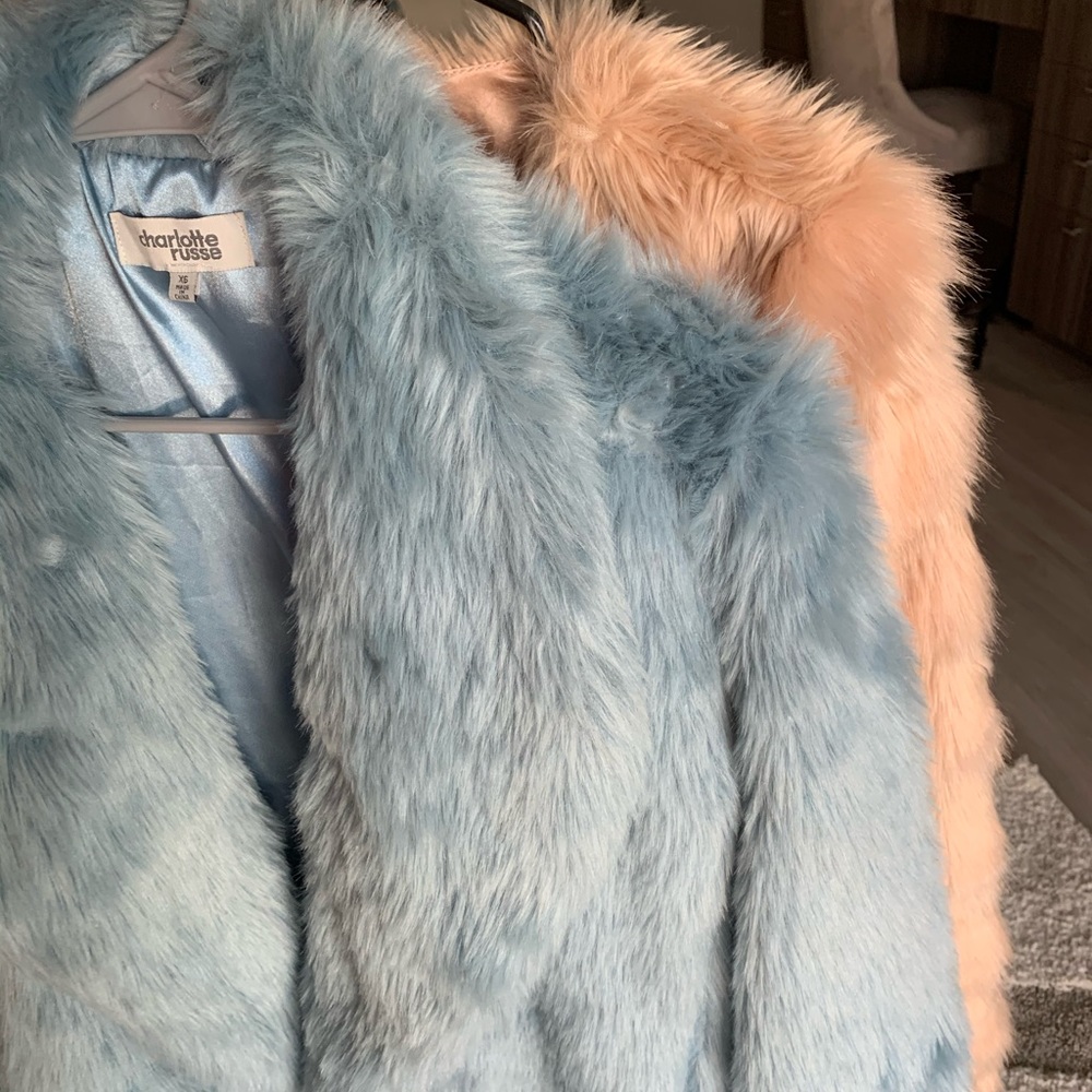 Two fur coats in pink and blue